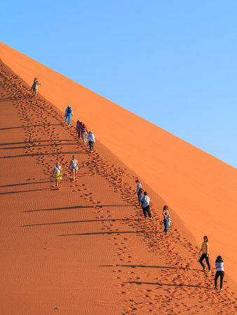 Sossusvlei, Namibia - 29 September 2018: Tourists on the famous dune 45. The southern part of the Namib Desert in the Namib-Naukluft National Park of Namibia.のeditorial素材