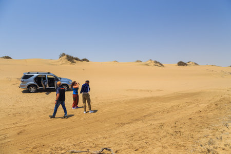 Walvis Bay, Namibia - 03 October 2018: Tourists on a 4x4 trip in the desert of the Namib- Naukluft National Park.のeditorial素材