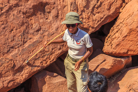 Twyfelfontein, Damaraland, Namibia - 05 October 2018: Tourists in Twyfelfontein, site of ancient rock engravings in the Kunene Region of north-western Namibia. Prehistoric Bushman engravings, rock painting.のeditorial素材
