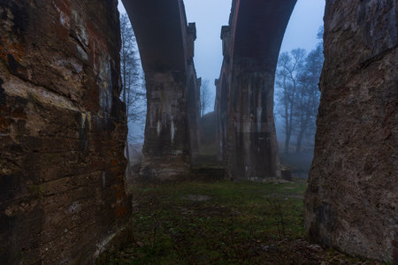 Old concrete railway bridge in Stanczyki. foggy morning. Masuria, Polandの写真素材