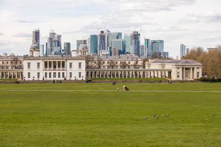 UK, London - 05 April 2019: View of the Queen House at center and Canary Wharf from Greenwich Park. City of London in the background.のeditorial素材