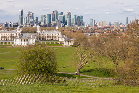 UK, London - 05 April 2019: View of the Queen House at center and Canary Wharf from Greenwich Park. City of London in the background.のeditorial素材