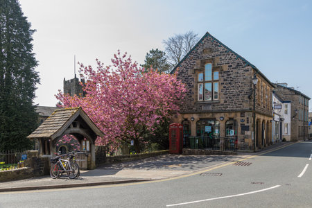 Sedbergh, Yorkshire, UK - 20 April 2019: Facade of a building in the village of Sedbergh . Sunny...