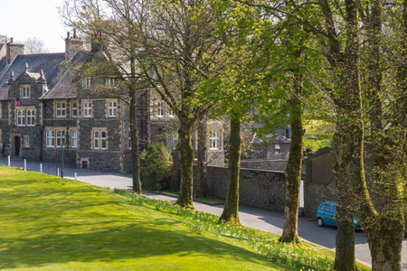 Sedbergh, Yorkshire, UK - April 20, 2019: View of the buildings of the Sedbergh village. beautiful garden. Sunny spring day. Yorkshire Dales, UKのeditorial素材