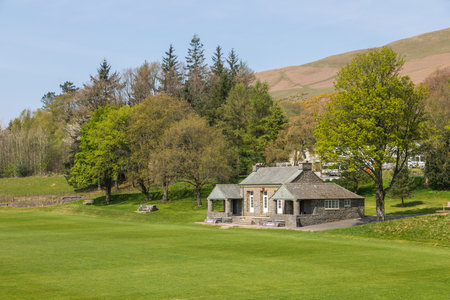 View of the buildings of the Sedbergh village. beautiful garden. Sunny spring day. Sedbergh, Yorkshire Dales, UKの写真素材