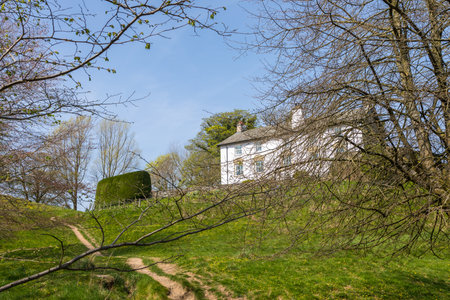 View of the buildings of the Sedbergh village. beautiful garden. Sunny spring day. Sedbergh, Yorkshire Dales, UKの写真素材