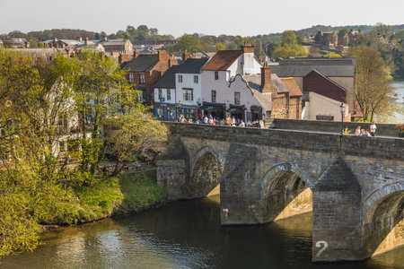 Durham, England, UK -22 April 2019: View of the Elvet Bridge, medieval masonry arch bridge across the River Wear in the city of Durham.のeditorial素材