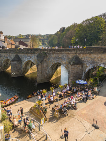 Durham, England, UK -22 April 2019: View of the Elvet Bridge, medieval masonry arch bridge across the River Wear in the city of Durham.のeditorial素材