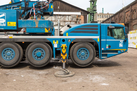 Gdansk, Imperial Shipyard, Poland - 01 May 2019: Mobile construction cranes with blue telescopic arms. heavy industry.のeditorial素材