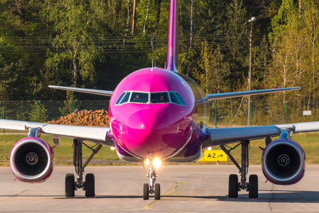 POLAND, GDANSK - 11 May 2019: Aircraft line Wizzair taxiing on the airport runway. The Lech Walesa Airport in Gdansk.のeditorial素材