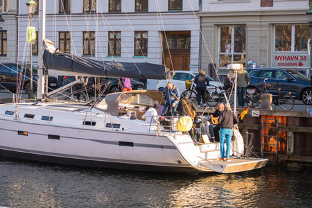 Denmark, Copenhagen - May 15, 2019: People on board the yacht. Canal in the center of Copenhagen.のeditorial素材