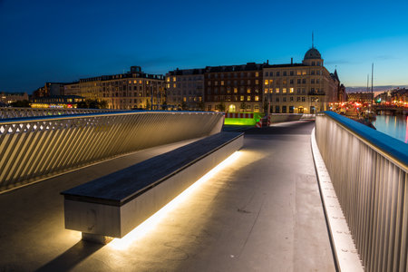 Denmark, Copenhagen - May 15, 2019: View of the modern buildings in Copenhagen at night. Bridge over the canal.のeditorial素材