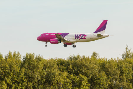 POLAND, GDANSK - 15 August 2019: Aircraft line Wizzair plane landing at the airport runway. The Lech Walesa Airport in Gdansk.のeditorial素材