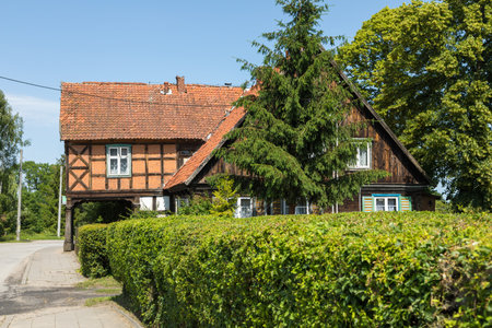 Zulawki, Zulawy, Poland - 15 June 2019: Traditional buildings of peasant architecture in Zulawy Wislane. spring season. sunny day.のeditorial素材