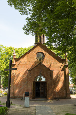 View of the Church of the Nativity of the Blessed Virgin Mary. Sunny spring day. Zulawki, Zulawy, Poland.の写真素材
