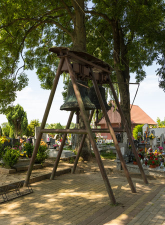 Zulawki, Zulawy, Poland - 15 June 2019: The bell tower at the Church of the Nativity of the Blessed Virgin Mary. Cemetery around.のeditorial素材