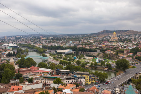 Tbilisi, Georgia - August 30, 2019: Old Tbilisi view from cable car: Peace Bridge, Concert Music...
