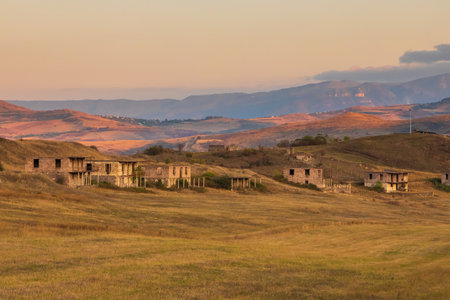 Abandoned buildings in the village of Voskepar. Mountain in the background. Armenia.の写真素材