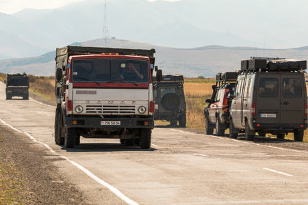 Angeghakot, Armenia - September 03, 2019: Large Transportation Truck on a road through the countryside. Caucasus Mountains.のeditorial素材