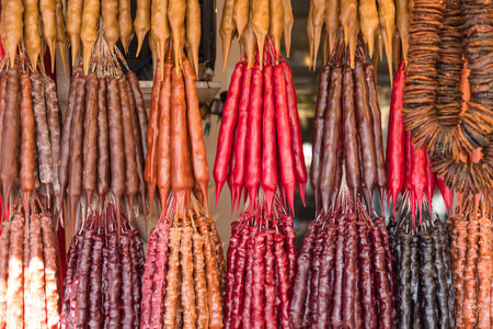 Churchkhela. Traditional Georgian sausage-shaped candy with grape must, nuts and flour. Eastern sweets, street food. Tbilisi, Georgia.の写真素材