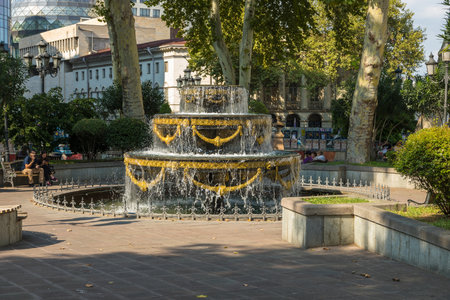 Tbilisi, Georgia - September 06, 2019: Decorative water fountain at Liberty Square. Beautiful sunny day.の写真素材
