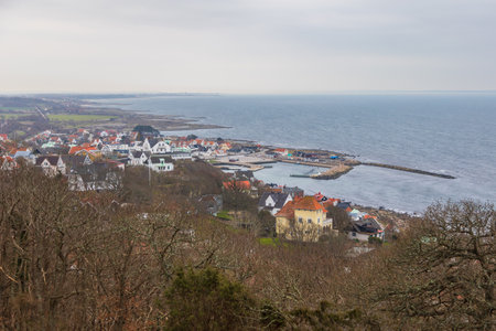 Colorful coastal village of Molle with scenic harbor and dramatic sea view on a cloudy day in Sweden.の写真素材