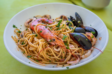 Close-up of spaghetti with shrimp, mussels and herbs served in Marsaxlokk, Malta.の写真素材