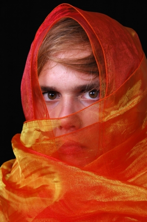 young man with burka close up portraitの写真素材