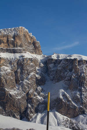 Sella and Sass Pordoi view from Passo Sella, Sellajoch, in the DOlomites. Sunny Day in Winter. Mountain coverede in Snowの写真素材