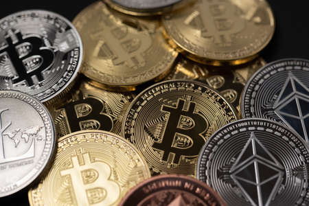 Ethereum Bitcoin and Litecoin physical coins. Cryptocurrency and Blockchain concept. Digital Money...