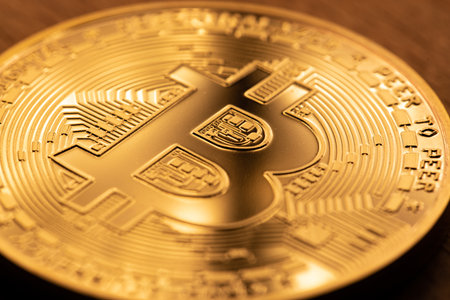 Gold Bitcoin coin, physical crypto currency coin Bit coin. Blockchain technology. Concept of digital...