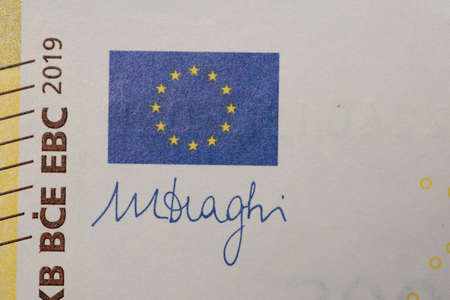 Closeup of 200 Euro Bill. Yellow European Banknote. European Central Bank currency. Euuropean Flag
