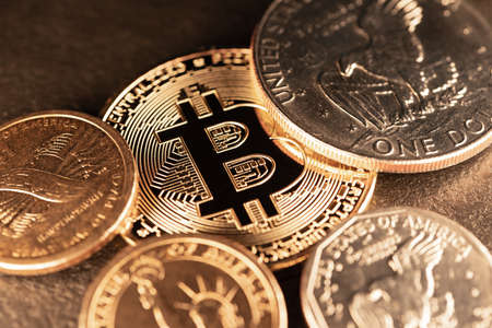 Dollar coins surrounding a Gold Bitcoin. Digital Crypto Currency with US Dollar Coins. Trading and...
