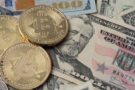 Bitcoin on fifty dollar banknotes. Trading with crypto currencies Bitcoin Ethereum and altcoins.