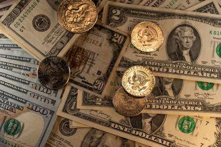 Rare US Dollar banknotes and coins. USD currency. Historic banknotes and coins. Half Dollar coins shining on paper moneyの写真素材