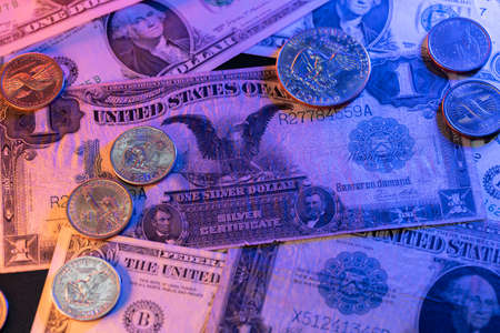 Historic US Dollar banknotes and coins. Black Eagle Dollar bill. One Dollar coins