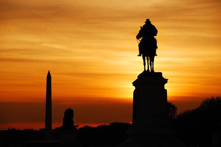 Statue of General Grant silhouette of US grant memorial and Washington Monument at sunset,...