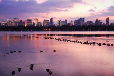 Central Park Sunset with New York City Skyline and dusks in lakeの写真素材
