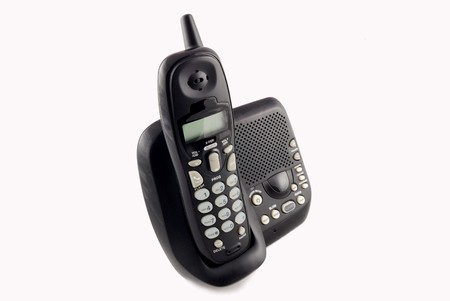 cordless phone with dock station closeup with white backgroundの写真素材