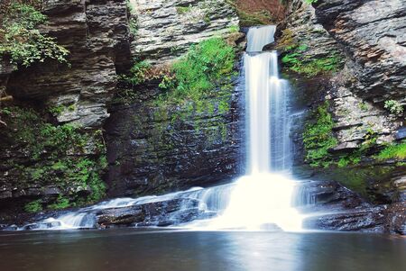 Waterfall in mountain with rocksの写真素材