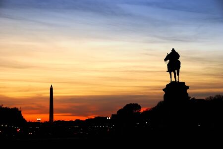 Statue of General Grant silhouette of US grant memorial and Washington Monument at sunset, Washington DC.の写真素材