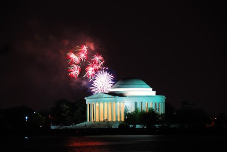 Thomas Jefferson Memorial illuminated with light and fireworks. Washington DC.のeditorial素材