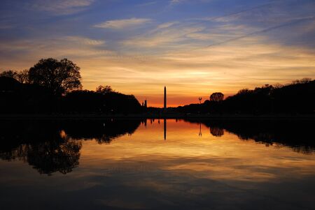 Washington monument sunset with lake reflection silhouette panorama, Washington DCの写真素材