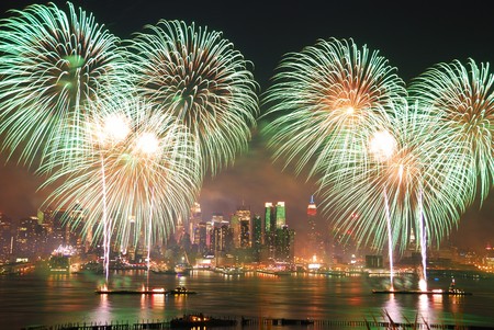 New York City Manhattan July 4th Independence day fireworks show with skyline over Hudson River viewed from New Jerseyの写真素材