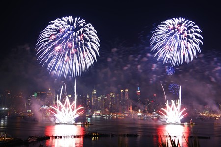New York City Manhattan July 4th Independence day fireworks show with skyline over Hudson River...