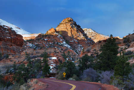 Zion National Park in the morning with red rocks, road and snow in winter, Utah.の写真素材