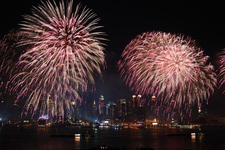 New York City Manhattan July 4th Independence day fireworks show with skyline over Hudson River viewed from New Jerseyの写真素材