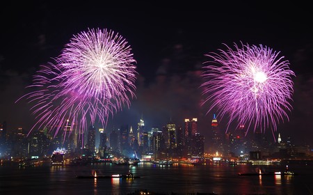 New York City Manhattan July 4th Independence day fireworks show with skyline over Hudson River viewed from New Jerseyの写真素材