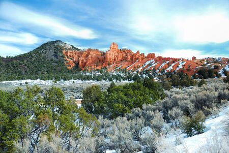 Red rocks in Bryce Canyon National Park with snow and trees in Utah.の写真素材