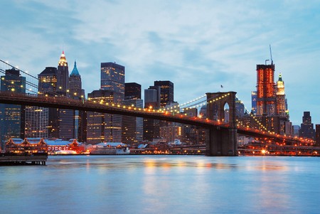 New York City Brooklyn bridge and Manhattan skyline at dusk.の写真素材